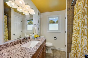 Bathtub, towels, soap, toilet paper