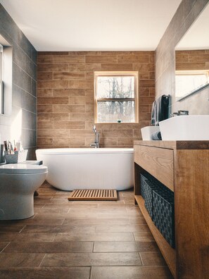 Bathtub, hair dryer, towels, soap