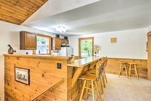 Enjoy cooking in this well-equipped kitchen with a central island and bar stools.