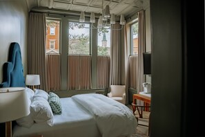 Room 1: First-Story Classic King | Down comforters, desk, blackout drapes, iron/ironing board - The Woodward Hotel (Macon)