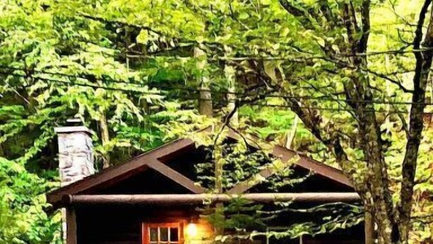 A rustic cabin with a chimney, a wooden door, and a bench outside. - Rustic Log Cabin #6 - "Fireside" (Lisbon)