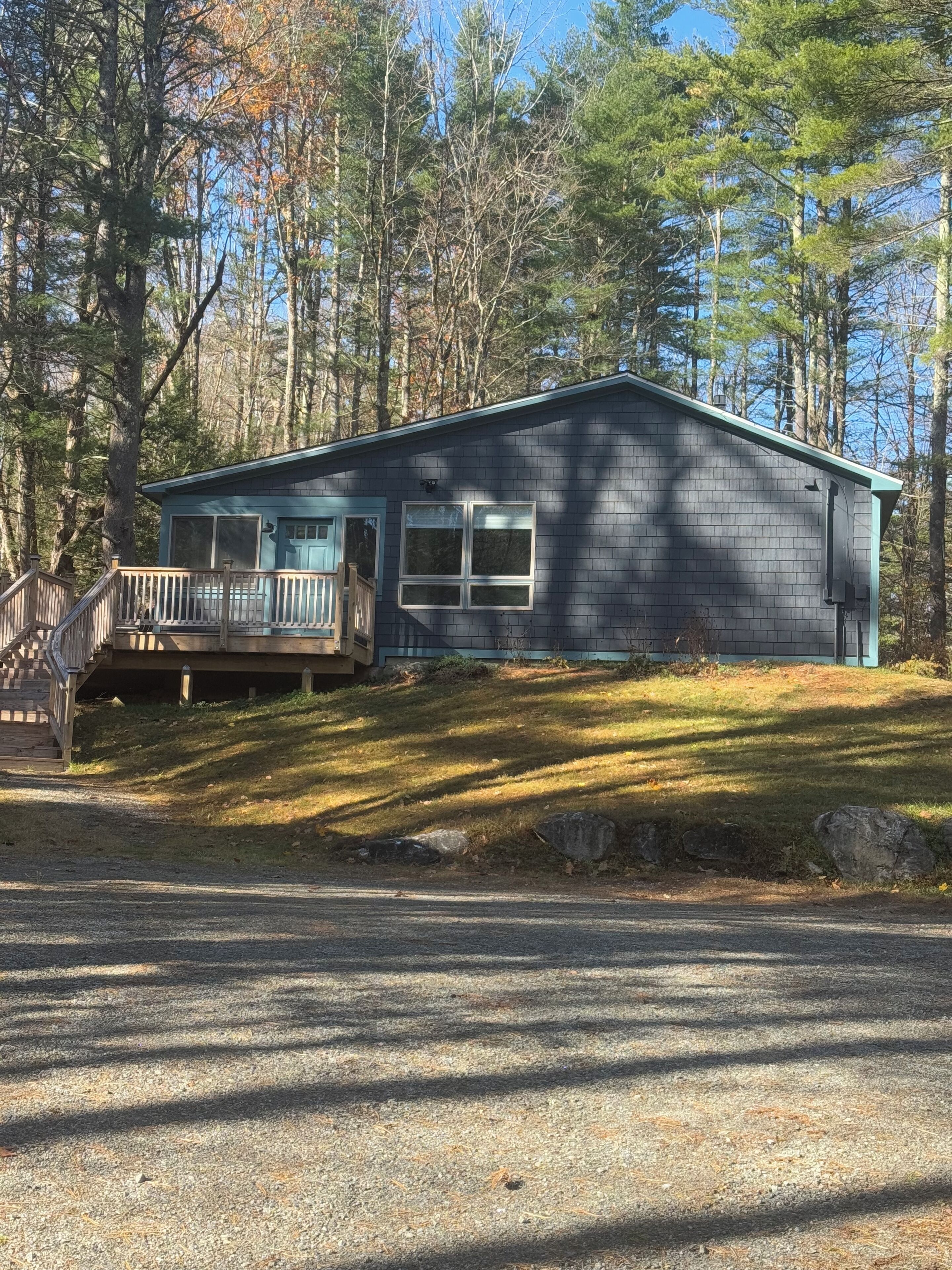 Charming cottage with roomy side deck.