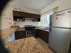 Exclusive Apartment | Private kitchen | Full-sized fridge, microwave, oven, stovetop - Luxury and Boutique Apartment by Bookhap (Playa del Carmen)