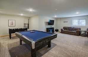 A pool table in a living room with a sofa and a television. - Sugarloaf GETAWAY w/ HOT TUB! Cabin close to ATV/Snow mobile trails. (Lead)