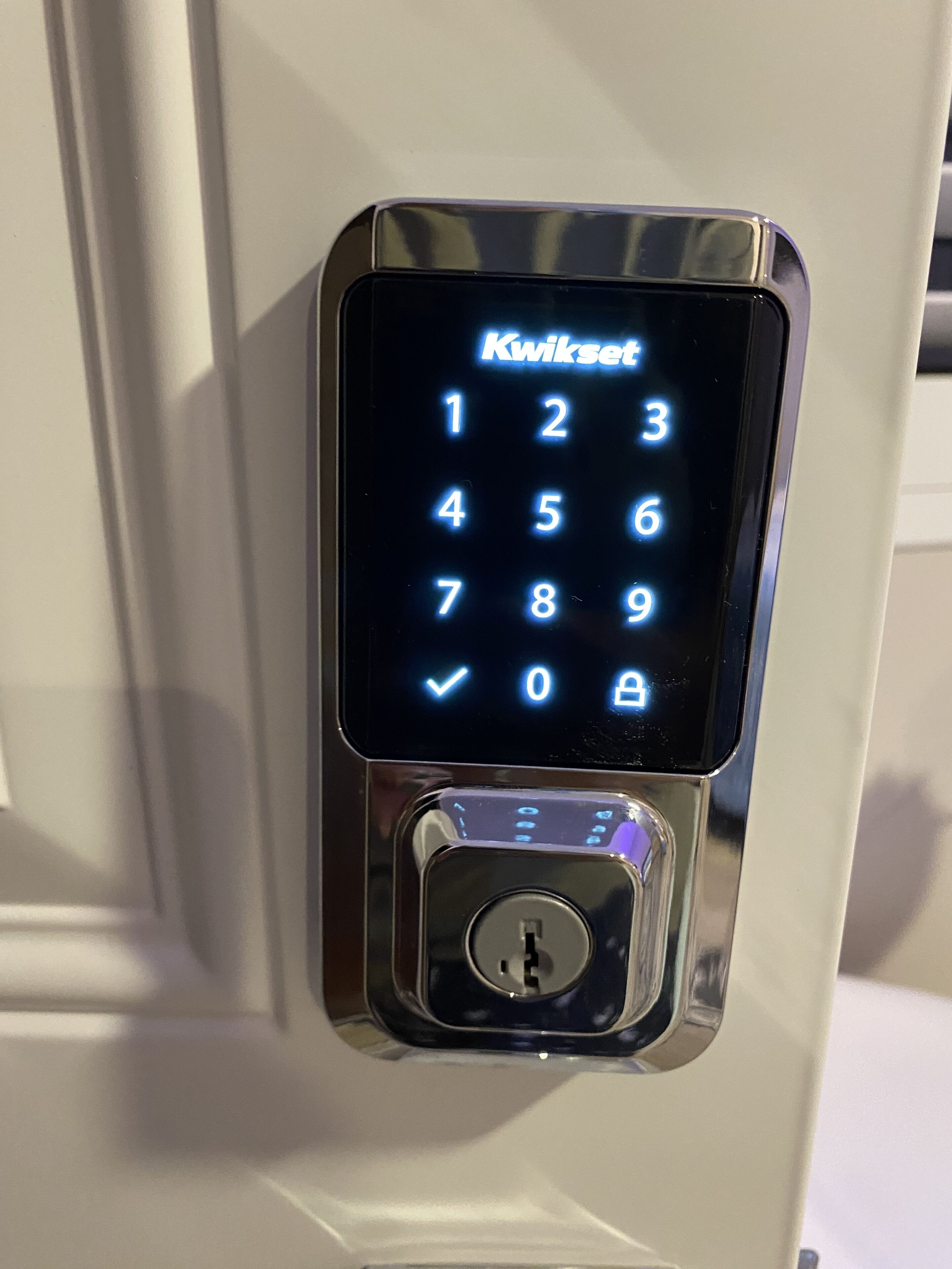 A Kwikset keypad lock on a door.
