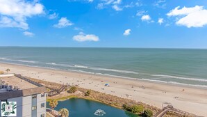 A beach view with a pool and a building with balconies. - 9th floor Studio with Incredible Views @ Myrtle Beach Resort (Myrtle Beach)