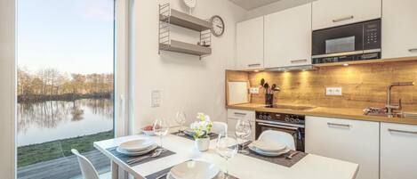 Fridge, stovetop, dishwasher, coffee/tea maker