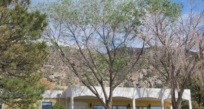 House against the Sandia mountains