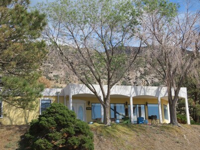 House against the Sandia mountains