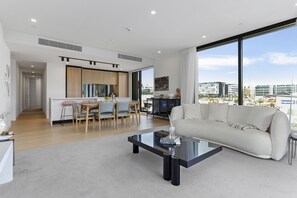 Deluxe Apartment | Living area | 50-inch Smart TV with digital channels, TV, Netflix