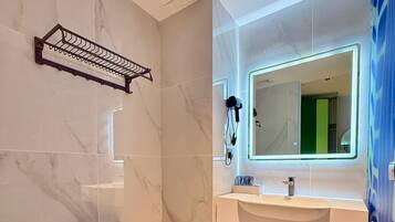 Shower, hair dryer, towels, soap