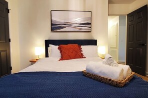 2 bedrooms, desk, blackout curtains, iron/ironing board