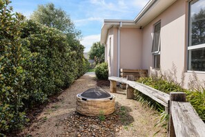 Sit by the fire pit and enjoy the serene surroundings.
