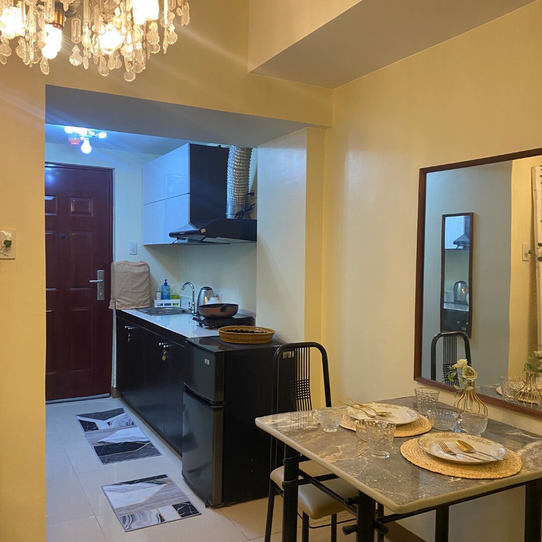 Fridge, electric kettle, cookware/dishes/utensils, dining tables