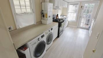 Fridge, microwave, coffee/tea maker, cookware/dishes/utensils