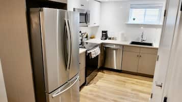 Coffee/tea maker, fridge, microwave, cookware/dishes/utensils
