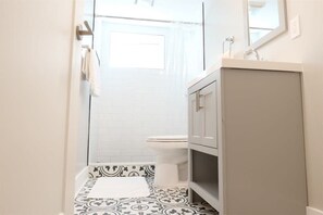 Bathtub, hair dryer, towels