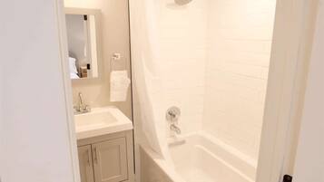 Bathtub, hair dryer, towels