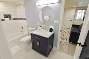 Bathtub, hair dryer, towels - Pristine Petworth | 4BR + Street Parking + Decks (Washington)