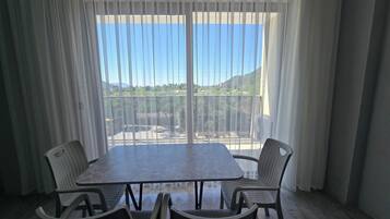 Family Apartment, 1 Bedroom, Non Smoking, Sea View | Living area | 32-inch LED TV with satellite channels, computer monitors