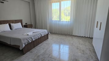 Family Apartment, 1 Bedroom, Non Smoking, Sea View | Premium bedding, desk, laptop workspace, soundproofing