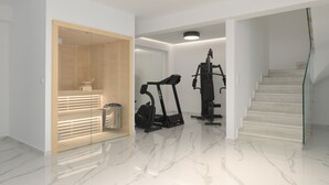 A modern home interior with a wooden sauna, a treadmill, and a stairway. - Ivory Villa, Heated Pool, Hot Tub, Sauna & Gym (Perama)