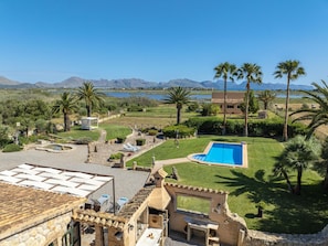 A pool area with a view of mountains and a body of water. - Villa Can Cosme · Your villa with private pool in Alcúdia. (Alcúdia)