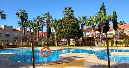 Apartment with terrace close to the golf course and the beach