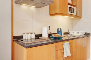 Fridge, microwave, stovetop, coffee/tea maker