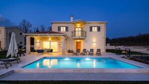 A two-story house with a swimming pool, outdoor seating, and a covered patio area. - Villa Lavanda Muntrilj with pool (Muntrilj)
