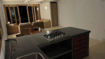 Fridge, dishwasher, coffee/tea maker, cookware/dishes/utensils