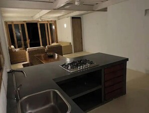 Fridge, dishwasher, coffee/tea maker, cookware/dishes/utensils