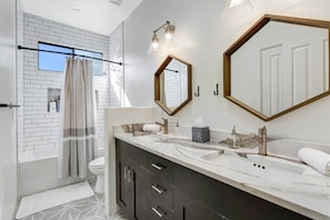Bathtub, hair dryer, towels, soap