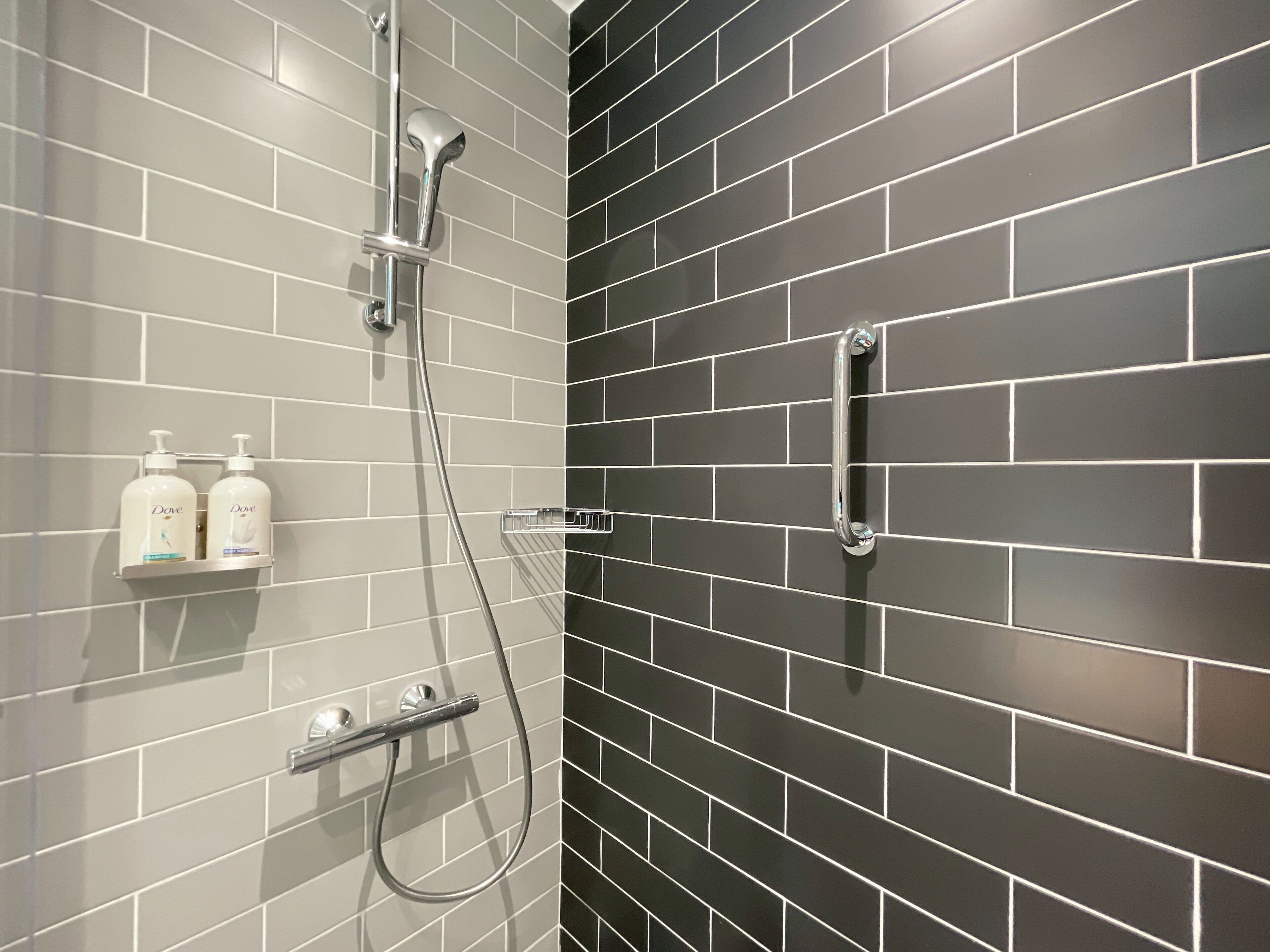 shower, rainfall showerhead, hair dryer, slippers