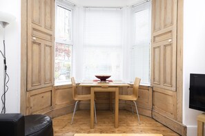 Apartment, 1 Bedroom, Patio | Living area | TV - JOIVY Charming 1-Bed Ap Near Leith Links W/ Patio (Edinburgh)