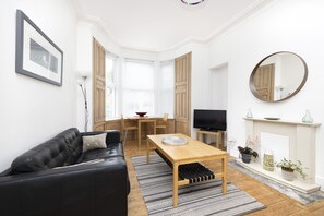 Apartment, 1 Bedroom, Patio | Living area | TV - JOIVY Charming 1-Bed Ap Near Leith Links W/ Patio (Edinburgh)