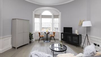 Studio, 1 Bedroom | Living area | TV