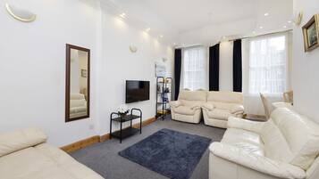 Apartment, 3 Bedrooms | Living area | TV