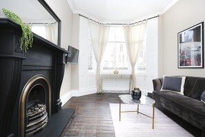 Apartment, 1 Bedroom | Living area | TV - JOIVY Modern 1-Br Apt W/ Communal Terrace In Trendy Stockbridge (Edinburgh)