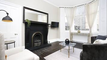 Departamento, 1 habitación | Área de sala de estar | Televisión