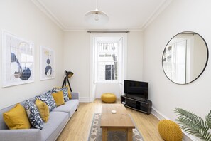 Apartment, 1 Bedroom, Patio | Living area | TV - JOIVY Chic Flat Near Stockbridge Market W/ Patio (Edinburgh)