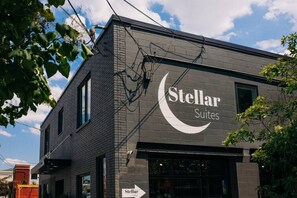 A building with a sign for 'Stellar Suites'.