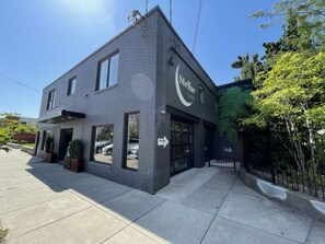 A modern building with a sign for "Stellar Suites." - Market #1 · Stellar Suites | King Loft | NuLu | Boutique Hotel (Louisville)