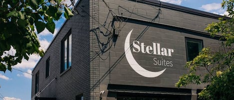 A building with a sign for 'Stellar Suites'.