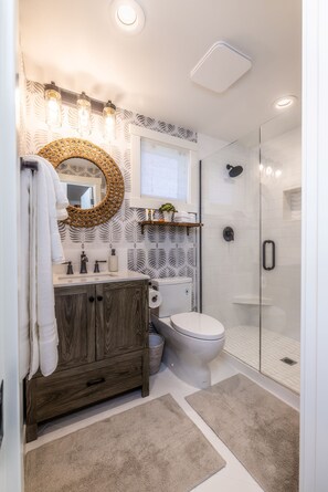 Shower, hair dryer, towels, soap