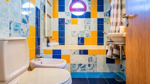 Bathtub, hair dryer, towels