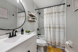 Combined shower/tub, hair dryer, towels, soap
