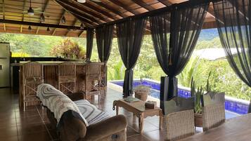 Superior Villa | Living area | 21-inch flat-screen TV with cable channels, TV