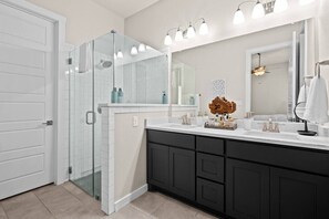 Bathtub, hair dryer, towels, soap