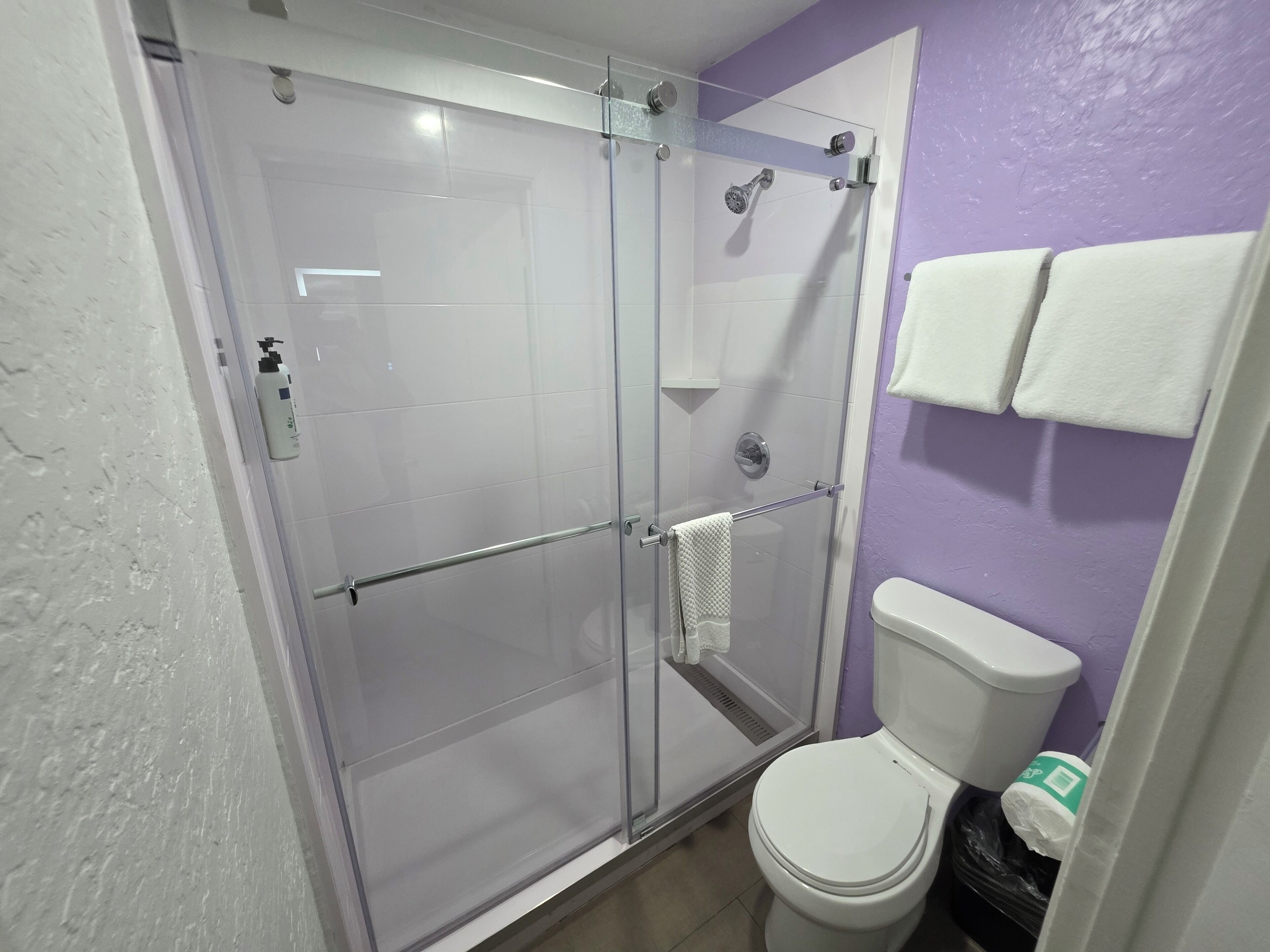 shower, designer toiletries, hair dryer, towels